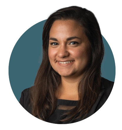 Dark-haired woman smiles at camera