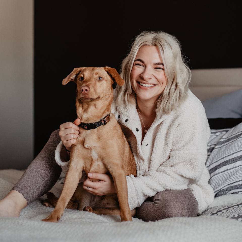 Jenna coppola and juni sitting on a bed