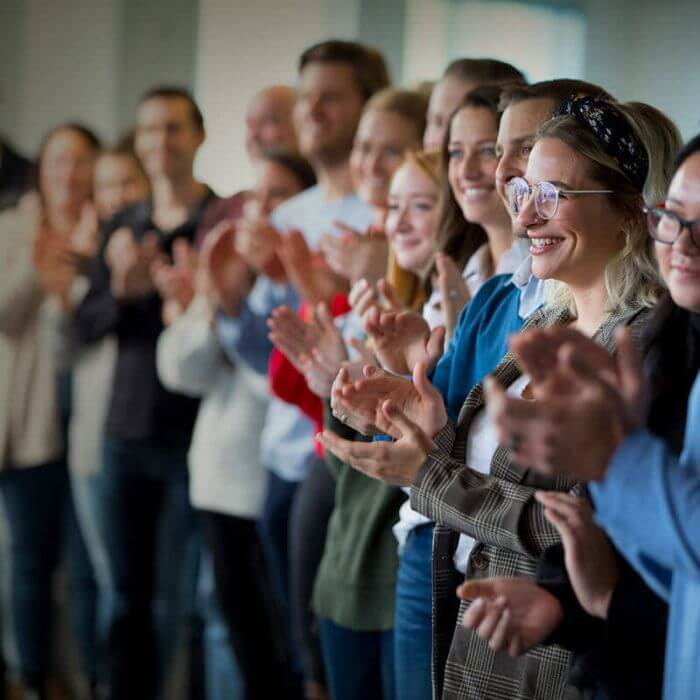 Terakeet employees clapping at circle up