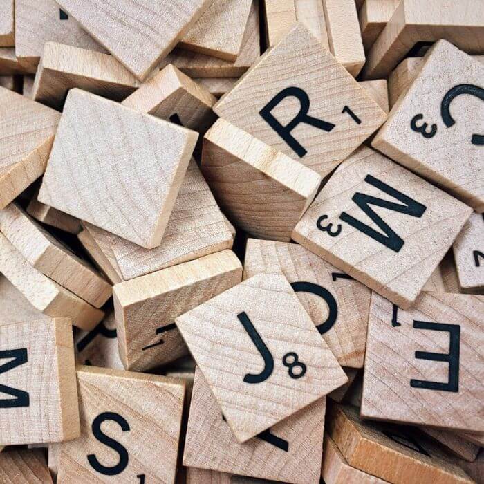 Jumbled wooden scrabble tiles