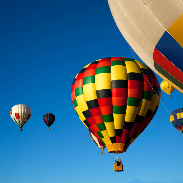 Hot air balloons float in the sky