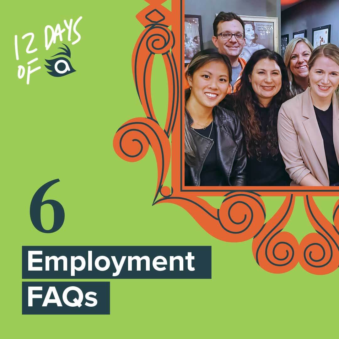 Four women and a man smile at a restaurant