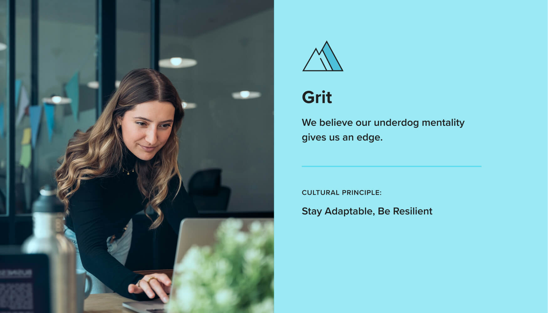 A woman in a black turtleneck types on a computer smiling beside a graphic describing Terakeet's Grit value and accompanying cultural principle.