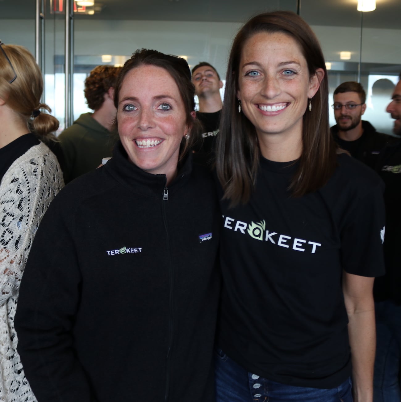 Two women wearing Terakeet gear pose for a photo together