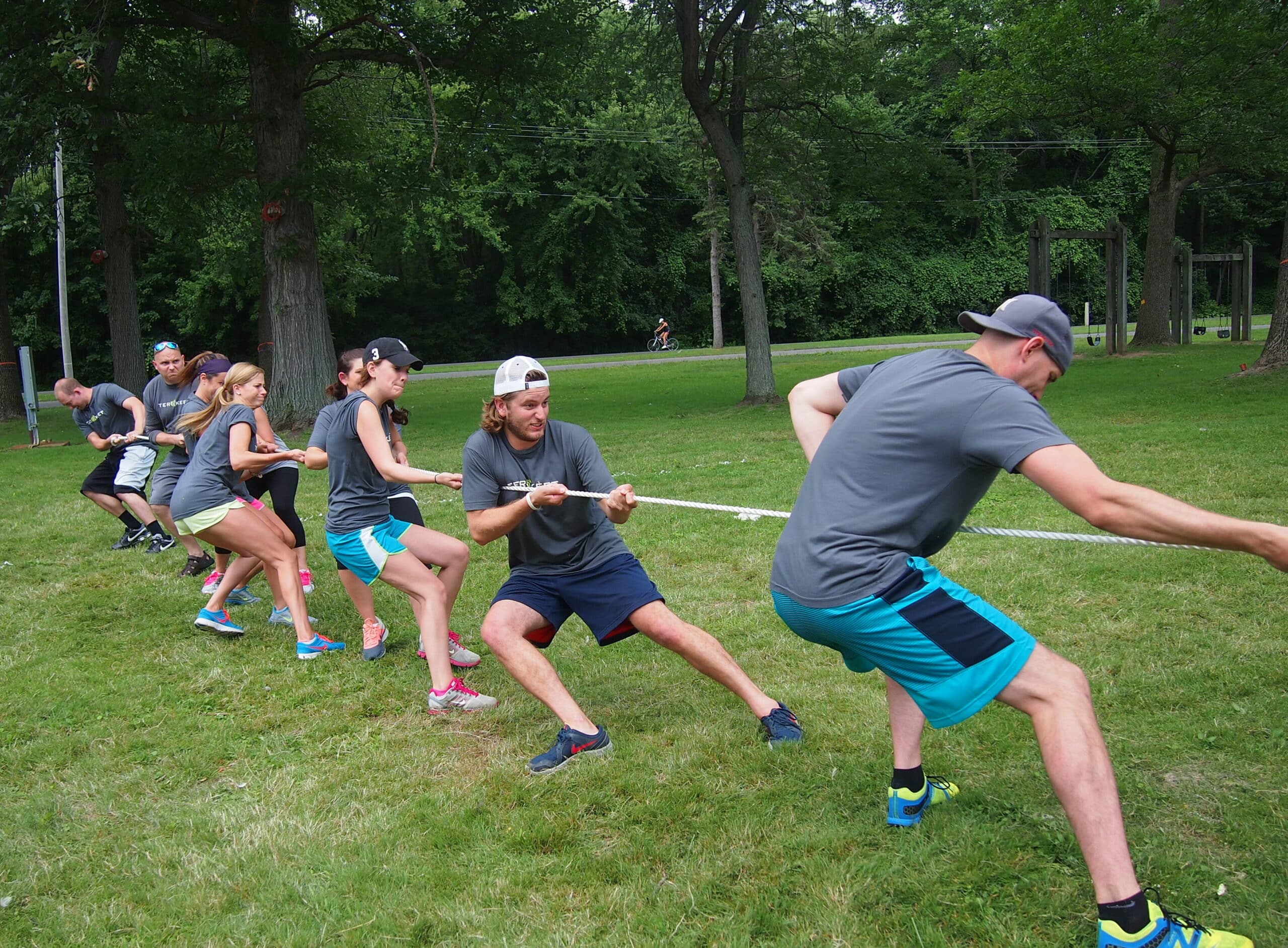 Several people compete in a tug-of-war competition