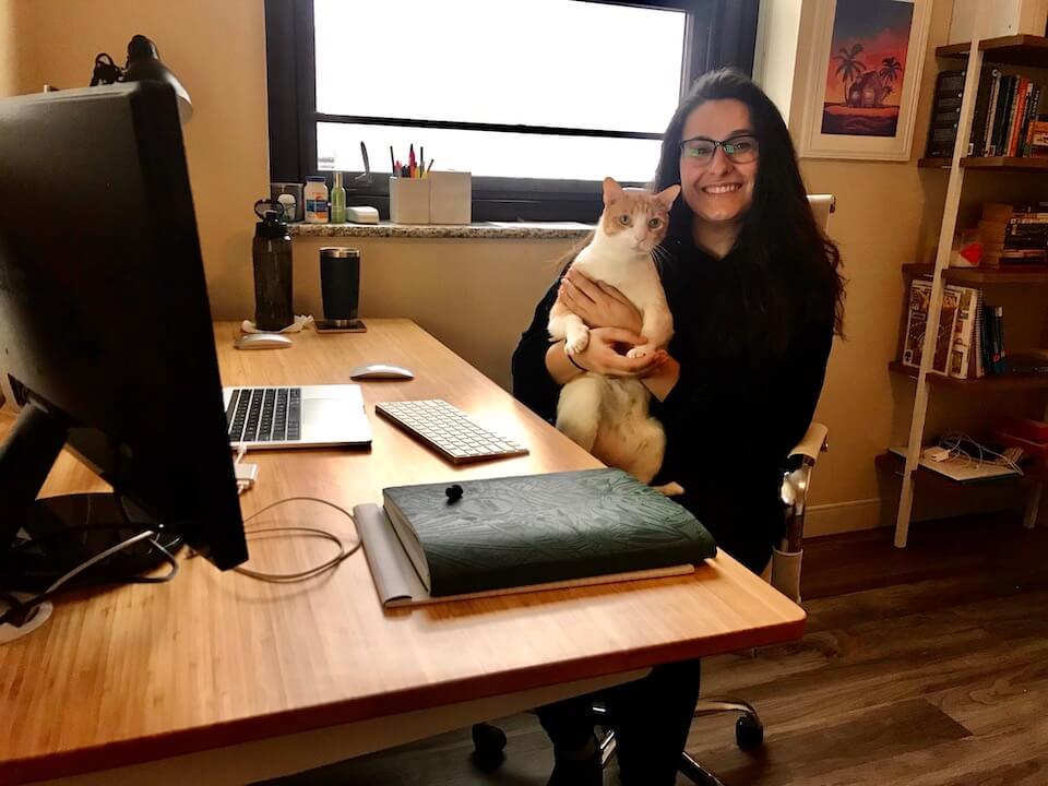 Gab K's home workspace and her cat, Jelly